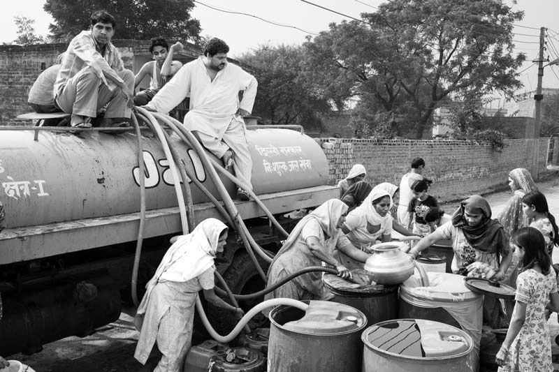 Rural Drinking Water Challenges - Collecting weekly water ration in a village in South-West district, National Capital Territory of Delhi